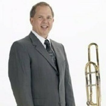 Norlan Bewley standing next to instrument